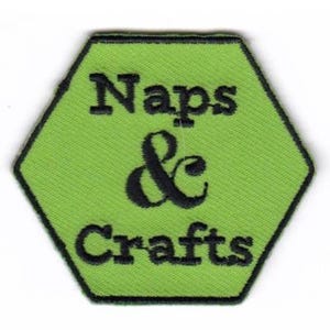 May include: Green hexagonal patch with black embroidered text that reads "Naps & Crafts".