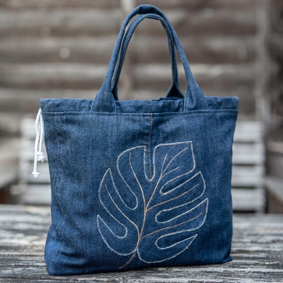 Soft tote bag from upcycled denim fabric with embroidery on the front  pocket - Advanced Embroidery Designs