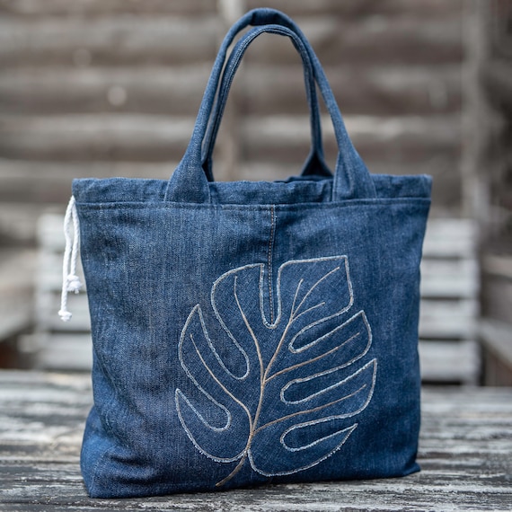 Soft tote bag from upcycled denim fabric with embroidery on the front  pocket - Advanced Embroidery Designs