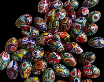 May include: A collection of colorful, oval-shaped glass beads with intricate floral patterns. The beads are a mix of red, green, blue, yellow, and white.