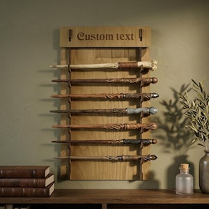 May include: Wooden wand display with seven intricately carved wands. The wands are various shades of brown and tan, each with unique designs. The display board is light brown with the text "Custom text" at the top.