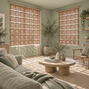 May include: A set of hanging room dividers composed of square, light brown wooden panels featuring intricate, laser-cut floral patterns. These modular panels are connected by small metal rings and suspended from horizontal rods over windows.
