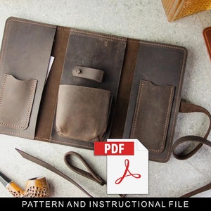 May include: A brown leather tobacco pouch with multiple pockets and a strap. The pouch is open and the inside is visible. The text "PDF" is visible on a red and white icon.