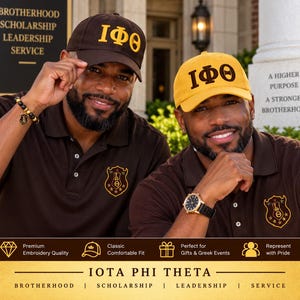 May include: Two baseball caps, one brown with gold Greek letters and one gold with brown Greek letters, featuring the Iota Phi Theta fraternity crest. The caps are worn with matching brown polo shirts that also display the fraternity crest embroidery.