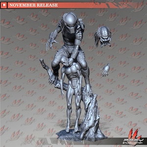 May include: A grey, detailed, 3D printed model of a Predator figure standing on a tree branch, holding a human figure in its hand. The Predator is wearing a helmet and has a weapon on its back. The human figure is nude and has a detailed muscular body. The model is set against a grey background with a red pattern.