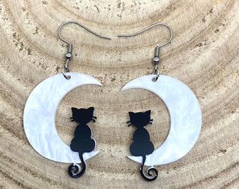 Pair of black cats sitting on a shimmering crescent moon earrings goth Wiccan new age fashion trendy novelty celestial