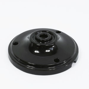 May include: Black ceramic ceiling rose with three holes and a central hole for wiring.