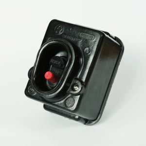 May include: Black Bakelite electrical switch with a red push button and the text "LOCK" and "634" visible.