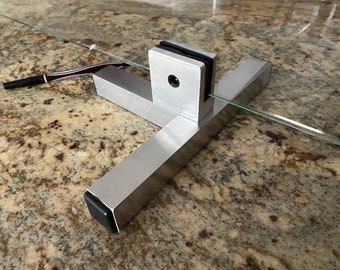 One bracket for plexiglass panels up to 36” tall ( panel not included)