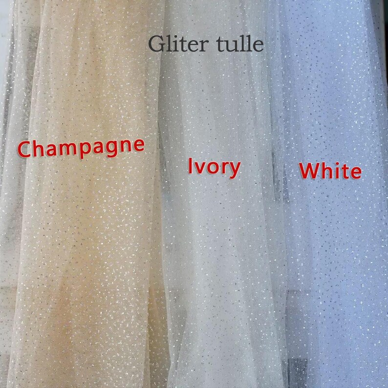 May include: Close-up of glitter tulle fabric in champagne, ivory, and white. The fabric is semi-transparent and has a sparkling effect. The text "Gliter tulle" is visible at the top of the image, with the colors labeled below.