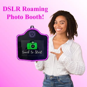 May include: A black and purple DSLR Roaming Photo Booth with a green camera icon and the words "touch to Start". A woman is pointing at the photo booth. The background is a gradient of pink and white.