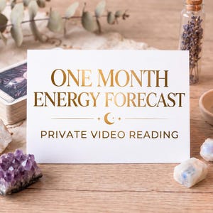 May include: A white rectangular card with gold foil text reading ONE MONTH ENERGY FORECAST PRIVATE VIDEO READING, accompanied by a deck of tarot cards, a yellow beeswax candle, a small glass vial of dried lavender, and raw crystals.