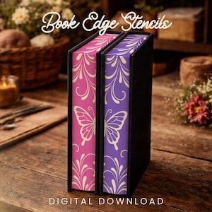May include: Two black book covers with pink and purple edges. The edges feature a butterfly design and the text "Book Edge Stencils" and "DIGITAL DOWNLOAD". The books are on a wooden surface.