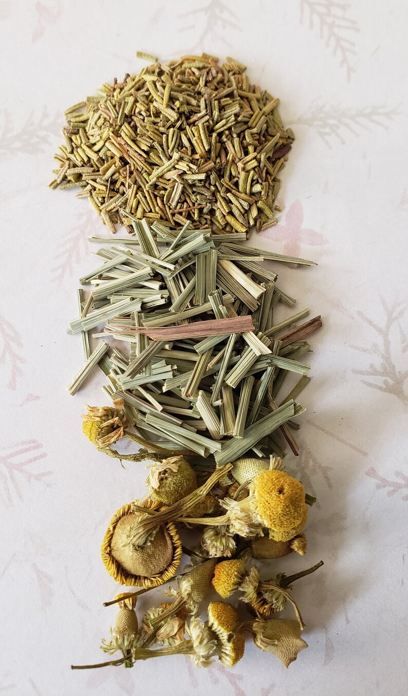May include: A mix of dried herbs including rosemary, lemongrass, and chamomile flowers.