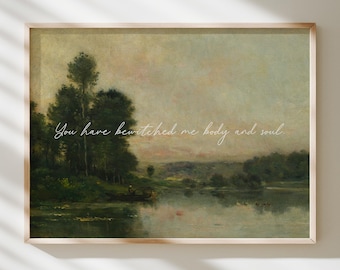 May include: A framed landscape print with a serene river scene, featuring trees and a soft, muted color palette. The text "You have bewitched me body and soul" is written across the image in a delicate script.