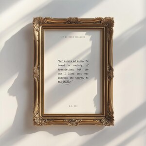 May include: A gold-framed print with a quote in black text: "Per aspera ad astra. I'd heard a variety of translations, but the one I liked best was Through the thorns, to the stars." The quote is attributed to W.L. 1810.