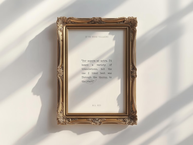 May include: A gold-framed print with a quote in black text: "Per aspera ad astra. I'd heard a variety of translations, but the one I liked best was Through the thorns, to the stars." The quote is attributed to W.L. 1810.