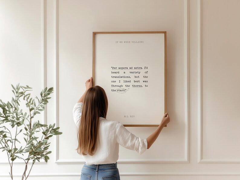 May include: A framed print with a white background and black text. The text reads "Per aspera ad astra. I'd heard a variety of translations, but the one I liked best was Through the thorns, to the stars." The text is attributed to W.B.  Yeats.
