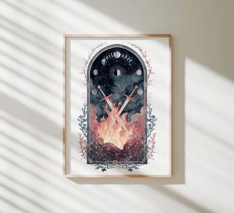 Puede incluir: Impresi&oacute;n art&iacute;stica enmarcada con una ilustraci&oacute;n en acuarela. La obra representa dos espadas cruzadas sobre una escena de fuego, con las palabras "world under" arqueadas en la parte superior. El dise&ntilde;o incluye elementos celestiales y bordes florales.