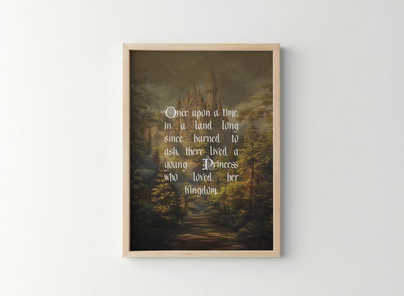 May include: Framed art print featuring a fairytale scene with a castle, trees, and a path. The text reads "Once upon a time, in a land long since burned to ash, there lived a young Princess who loved her kingdom."