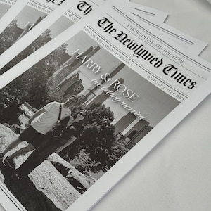 May include: Several black and white wedding announcement cards. The headline reads "The Newlywed Times" with the date "20th November 2025". The names "HARRY & ROSE" are featured prominently. The cards are stacked on a white surface.