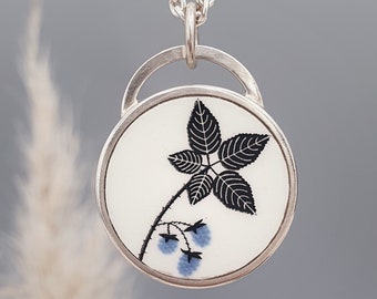 Recycled ceramic with flower framed in 925 sterling silver / handmade pendant
