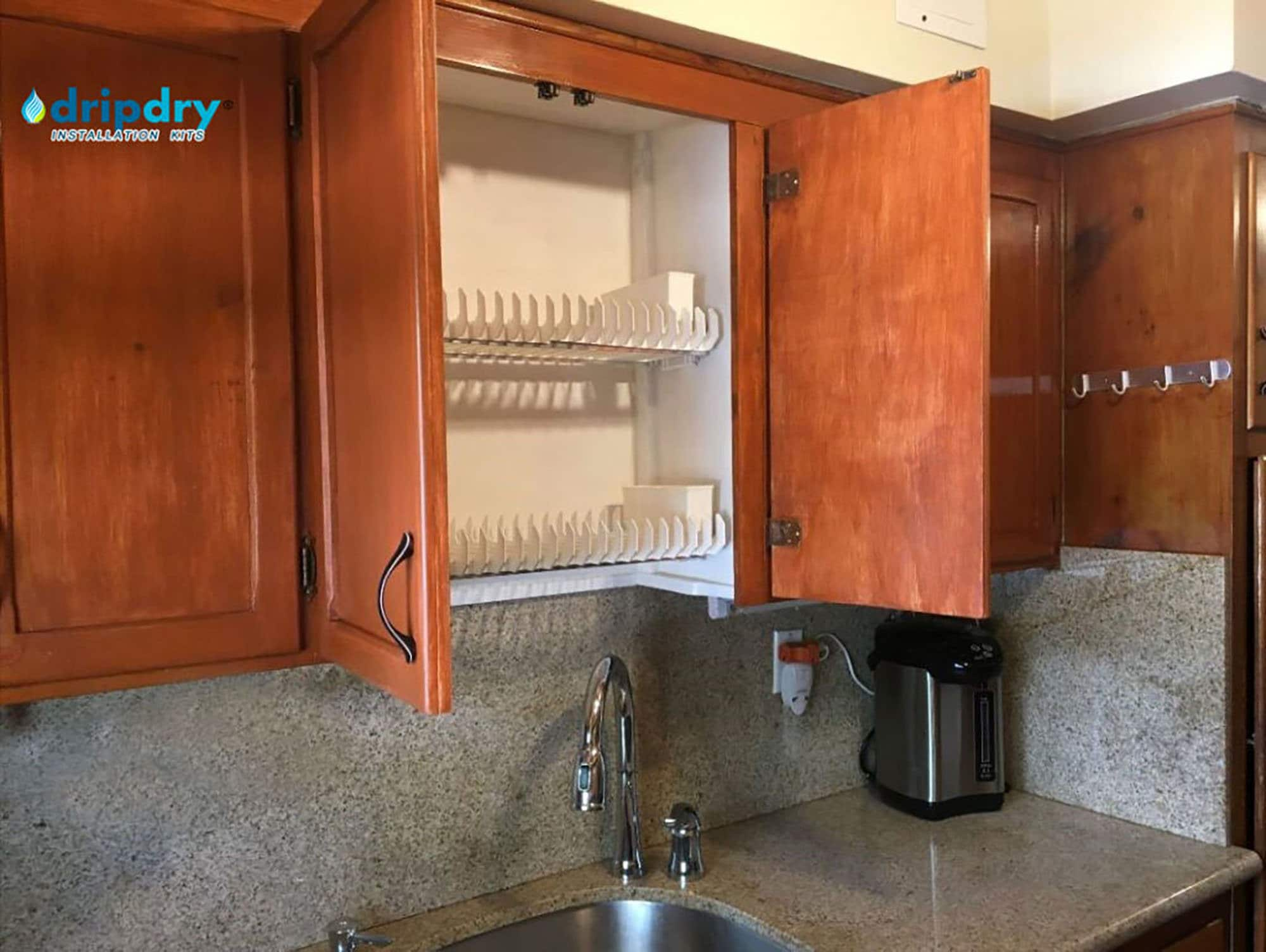 Custom, in-cabinet dish drying rack. Water drips directly into the sink. -  Transitional - Kitchen - Seattle - by Genay Bell Interior Design