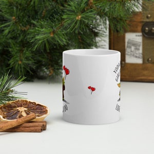 May include: White ceramic mug with a green and brown cartoon character holding red balloons. The text "Yoda Girl, I Love You" is printed on the mug.