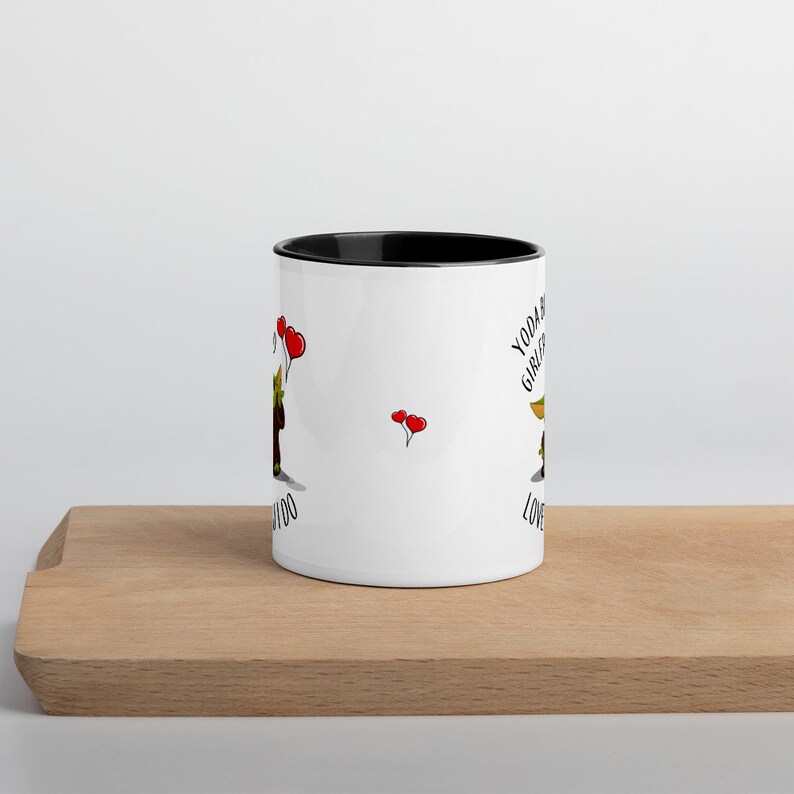May include: White ceramic mug with a black rim. The mug features a cartoon image of a green character with large ears and the text "Yoda Best Girlfriend Love You Too". There are red hearts floating around the character.
