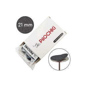 May include: A package of 21 mm felt furniture pads with the text "The Pillochi" and "ThePillochi.ua" on the box. The pads are gray and round.