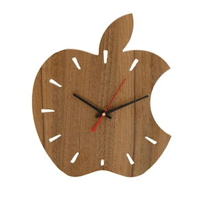 May include: A wooden wall clock shaped like an apple with a red second hand and black hour and minute hands.