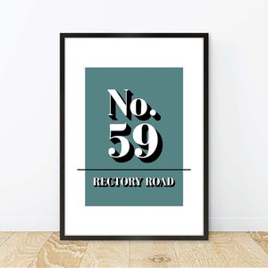 May include: Framed wall art featuring the number "59" in white, with a black shadow effect, set against a teal background. Below the number, the text "RECTORY ROAD" is displayed in a bold, sans-serif font. The artwork is enclosed in a black frame.