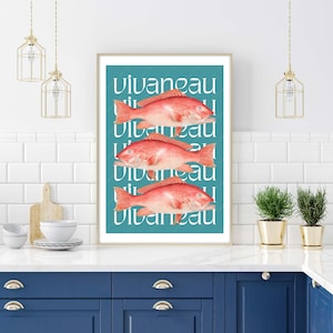 May include: A framed print with a teal background and three red fish. The fish are stacked on top of each other and the word "vivaneau" is repeated in white text.