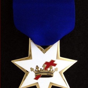 May include: A gold and white star-shaped medal with a red cross and a gold crown. The medal is suspended from a blue ribbon.