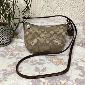Coach Sac à Main Femme en Toile et Cuir Vintage Sac à Bandoulière Minimaliste Monogramme Coach Baguette