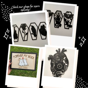 May include: A set of four black wooden wall decor pieces featuring a heart, a crow, a rose, and a coffin. The pieces are arranged in a row and have a rustic, gothic aesthetic. The text "Forever My Boo!" is written on a wooden sign with a heart and two ghosts.