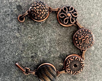 Antiqued copper plated button bracelet with a Southwest theme