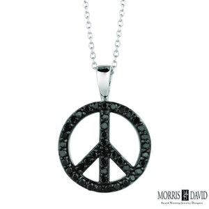 May include: A silver chain necklace with a black diamond peace sign pendant.