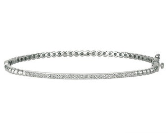 May include: A silver bangle bracelet with a row of small diamonds around the center.