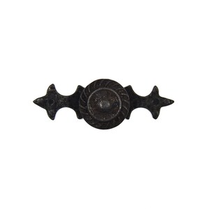 May include: Black metal drawer pull with a decorative, round knob and ornate, pointed ends.