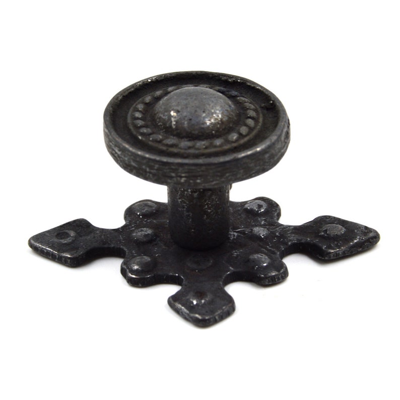 May include: Black metal cabinet knob with a round top and a cross-shaped base.