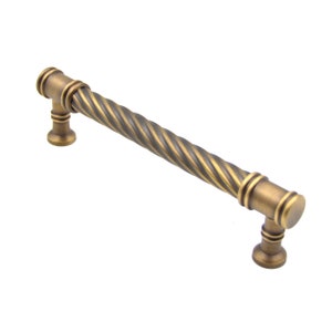 May include: A twisted brass cabinet pull with a dark antique finish. The pull is 5 inches long and has a simple, elegant design.