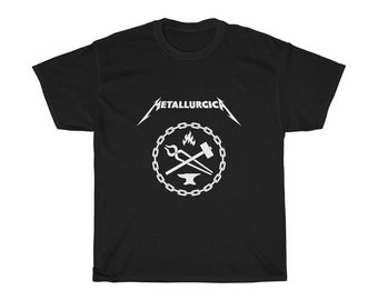 May include: Black t-shirt with a white graphic of a blacksmith's tools, an anvil, and a flame inside a chain circle. The text "METALLURGICA" is above the graphic.