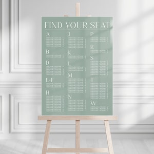 May include: A sage green wedding seating chart with the text "FIND YOUR SEAT" at the top. The chart lists alphabetical table names with corresponding guest names.