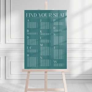 May include: A teal blue wedding seating chart with the text "FIND YOUR SEAT" at the top. The chart lists guest names alphabetically by last name under letters of the alphabet.