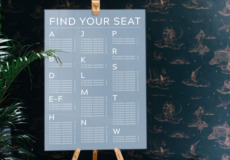 May include: A gray seating chart with the text "FIND YOUR SEAT" at the top. The chart is divided into columns with letters from A to W and lists names with corresponding numbers.