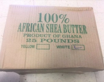 May include: A cardboard box labelled "100% African Shea Butter, Product of Ghana, 25 Pounds, Yellow, White".