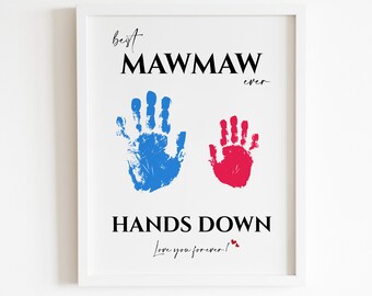 May include: White framed print with the text "Best Mawmaw Ever" and "Hands Down" with two handprints in blue and red. The text "Love you forever!" is written in cursive with two small red hearts.