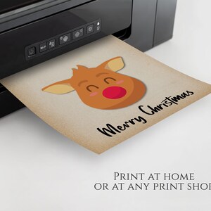 May include: Printable Christmas card featuring a cartoon reindeer with a red nose and the text "Merry Christmas".