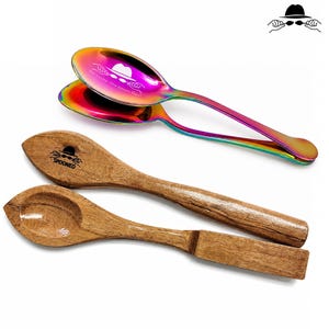 May include: Two iridescent rainbow-coloured metal spoons with a white logo featuring a hat and glasses, alongside two wooden spoons with a natural grain finish and a black logo that reads SPOONED, all arranged on a plain white background.
